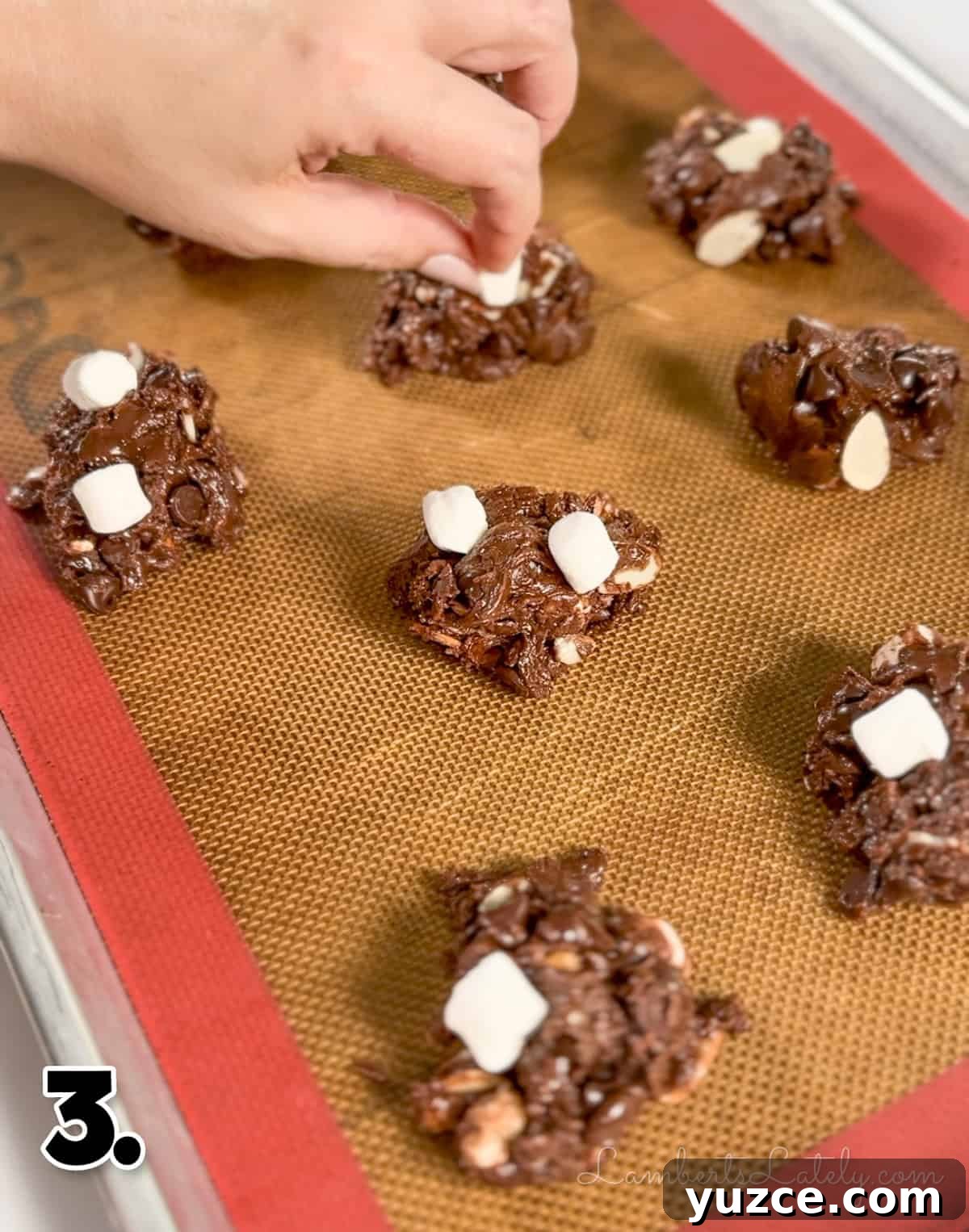Decadent Rocky Road Cookies with Chocolate, Nuts & Marshmallows 6 placing marshmallows on top of unbaked rocky road cookies.