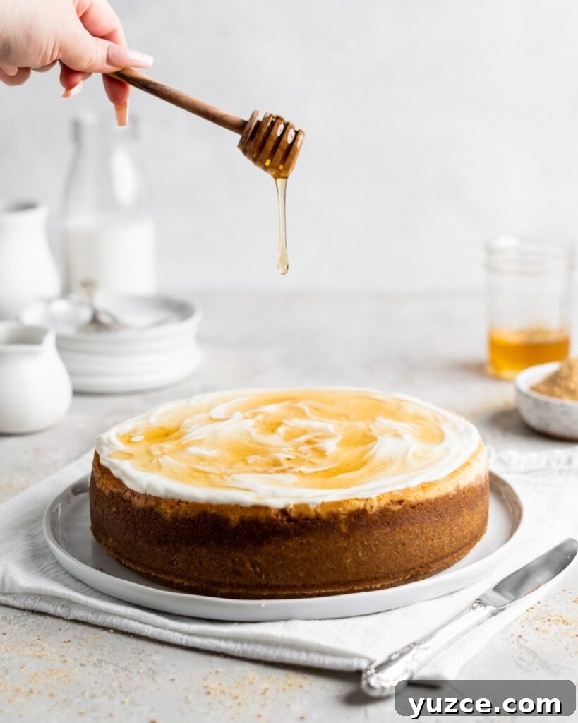 Salted Honey Cheesecake Recipe with Crispy Graham Crust 2 Creamy Salted Honey Cheesecake has a graham cracker crust and a sour cream topping. Drizzled with additional salted honey