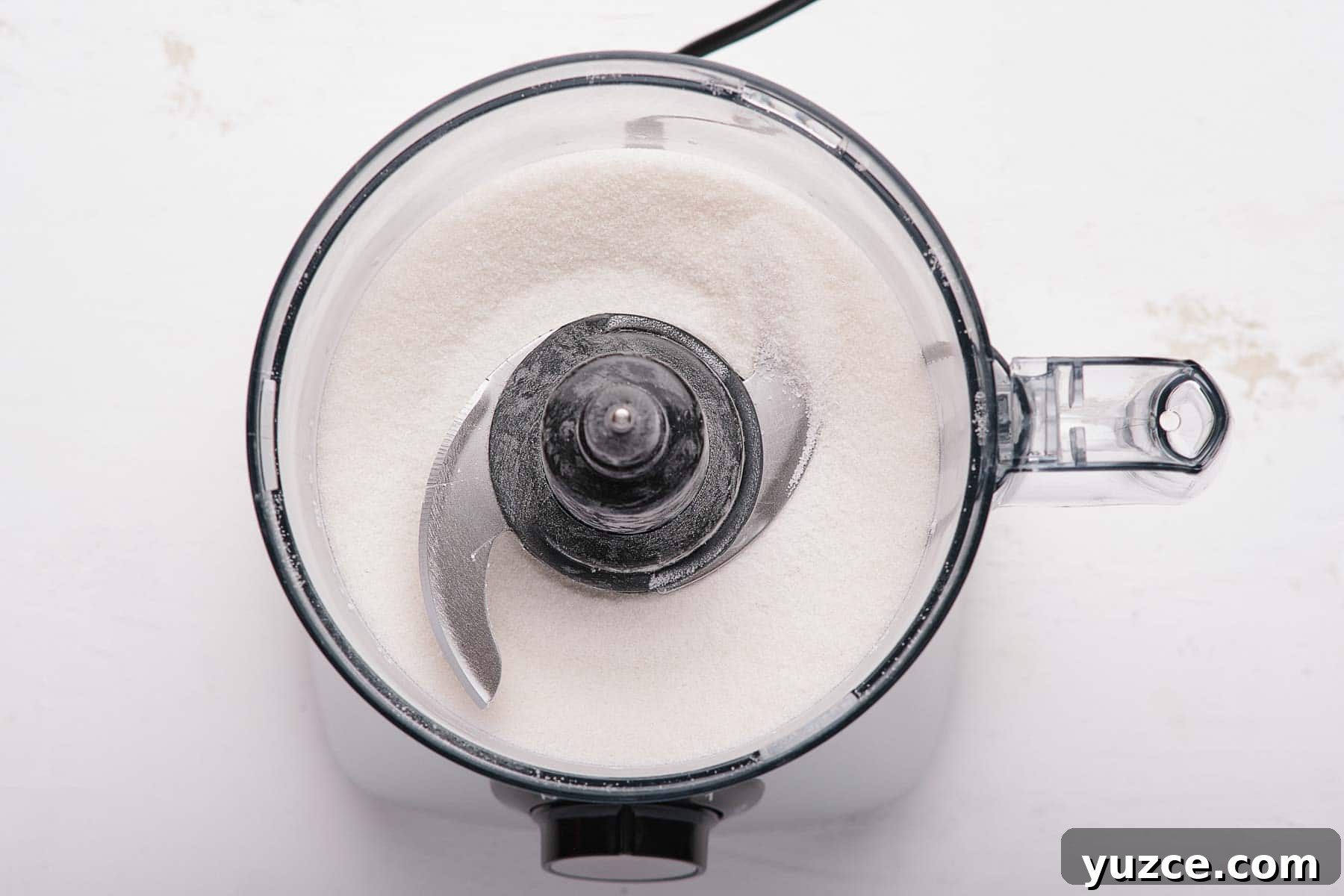 Blueberry Sherbet Recipe: Refreshing Homemade Frozen Treat 10 Grinding sugar in a food processor.