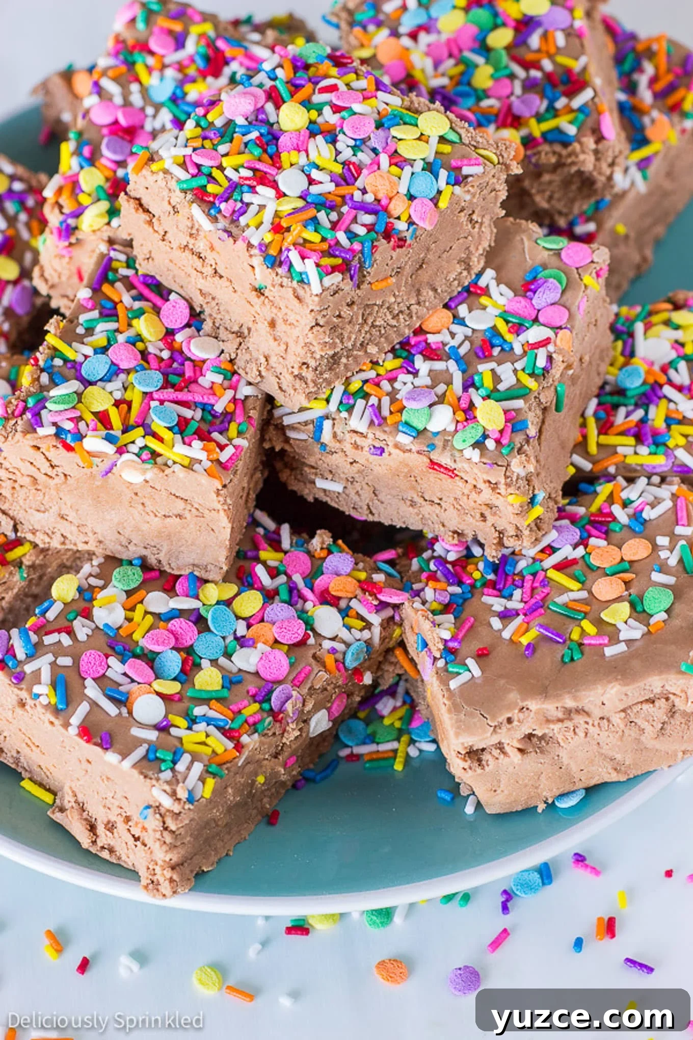 Creamy Marshmallow Fudge Recipe: Soft, No-Bake Treat 2 Marshmallow cream fudge stacked on a plate.