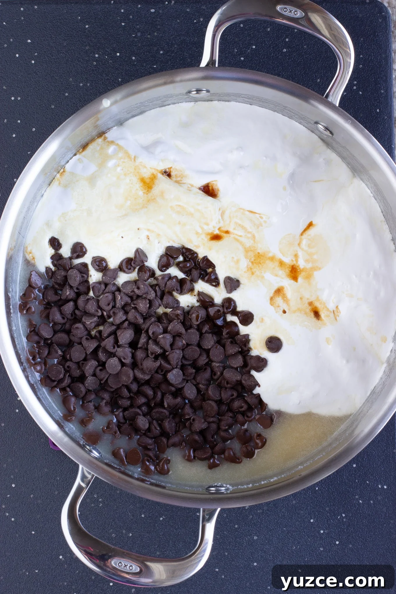 Creamy Marshmallow Fudge Recipe: Soft, No-Bake Treat 4 A pot of milk, butter, chocolate chips and marshamallow cream to make fantasty fudge.