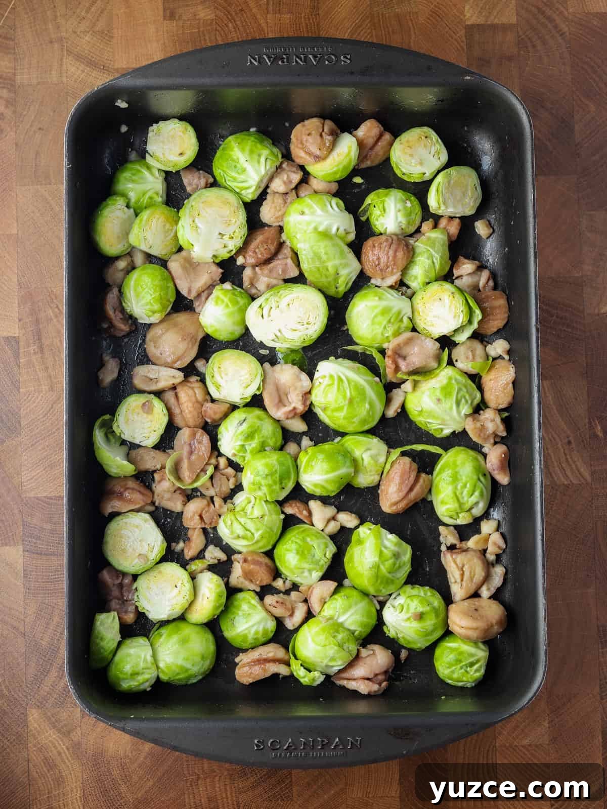 Smoky Roasted Brussels Sprouts with Chestnuts (Vegan) 5 Photo of brussles sprouts and chestnuts in a roasting tin ready to roast.