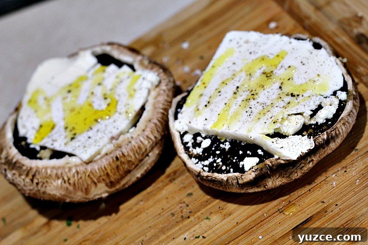 Cheese-Stuffed Portobello Mushrooms Recipe for Weeknight Dinner 3 Cheese Stuffed Portabella Mushrooms on cutting board before grilling