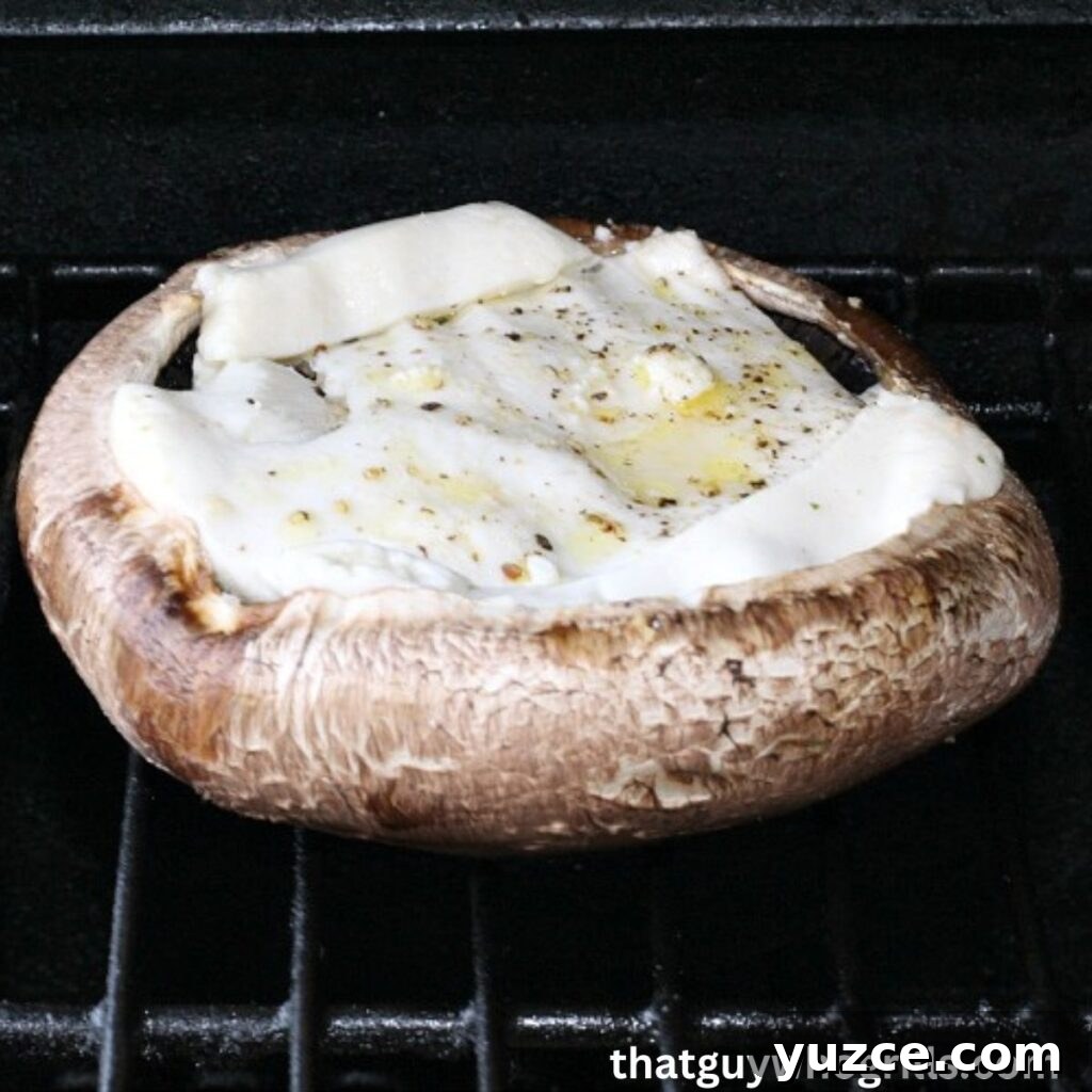 Cheese-Stuffed Portobello Mushrooms Recipe for Weeknight Dinner 4 Grilled Cheese Stuffed Portabella Mushroom Cooking On Grill