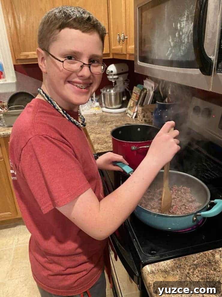 boy learning life skills cooking