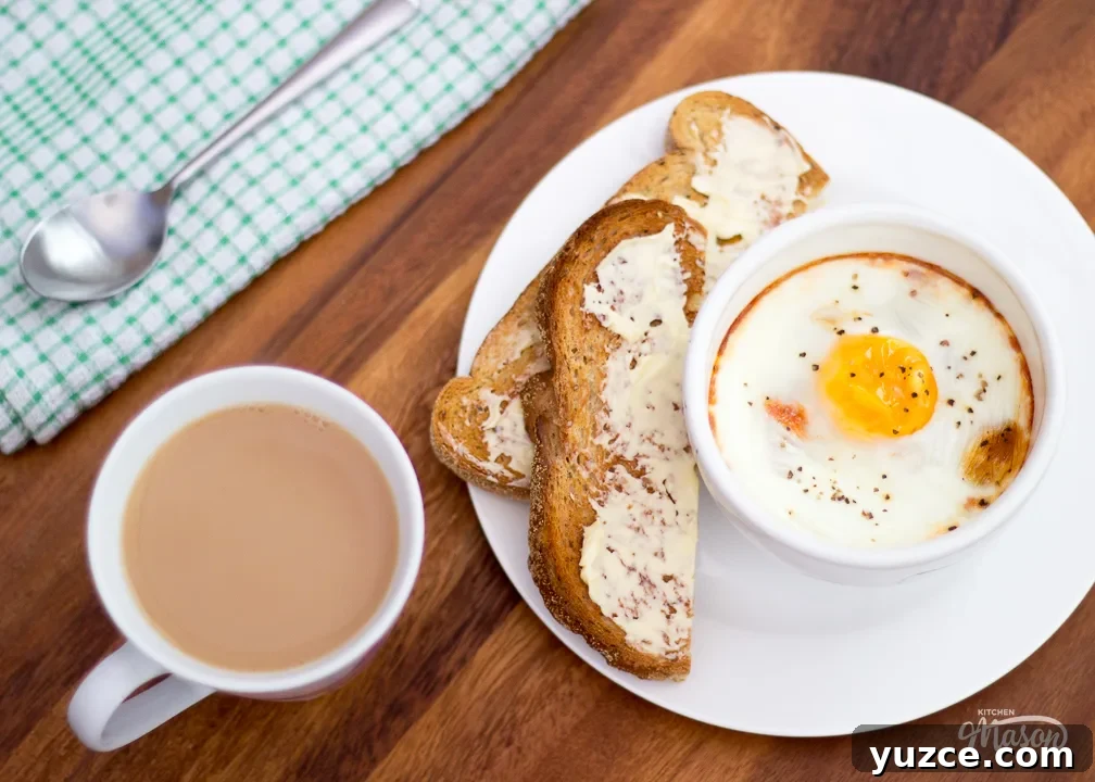 Tomato Baked Eggs with Ham Recipe: Savory One-Pan Breakfast 8 Tomato baked eggs in a bowl with some toast