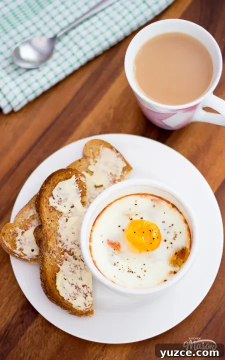 Tomato Baked Eggs with Ham Recipe: Savory One-Pan Breakfast 2 Tomato baked eggs and a cup of tea on a worktop