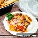 Quick Ravioli Lasagna Recipe for Busy Weeknight Dinners 11 Image of finished lazy ravioli lasagna plated on white dish