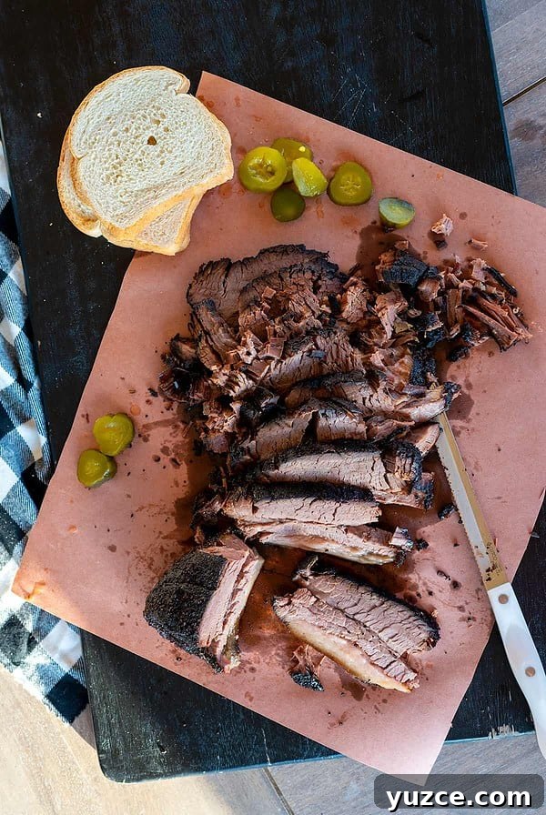 When to Trim Brisket: Timing and Tips for Perfect Smoke 6 platter of smoked brisket cooked on the Ninja Woodfire Grill.