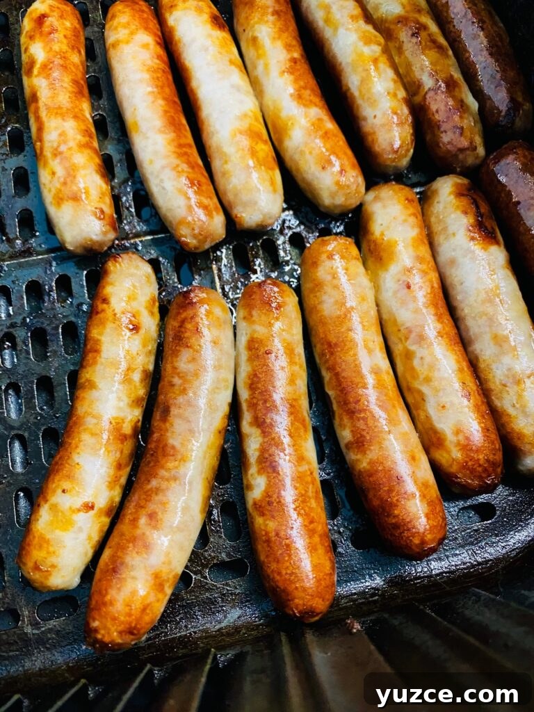 Sausage Pancake Corn Dogs Recipe: Crispy Breakfast on a Stick 4 sausage links in air fryer after cooking