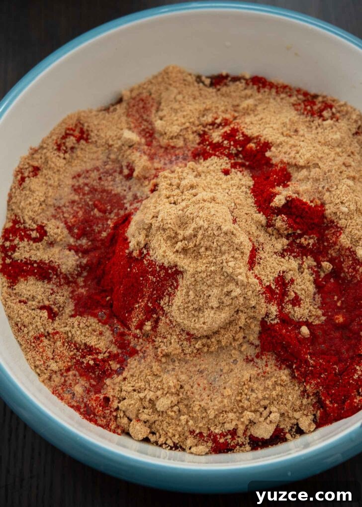 Quick 10-Minute Homemade Gochujang Recipe 10 Gochugaru and mejugaru added to the rice syrup salt mixture.