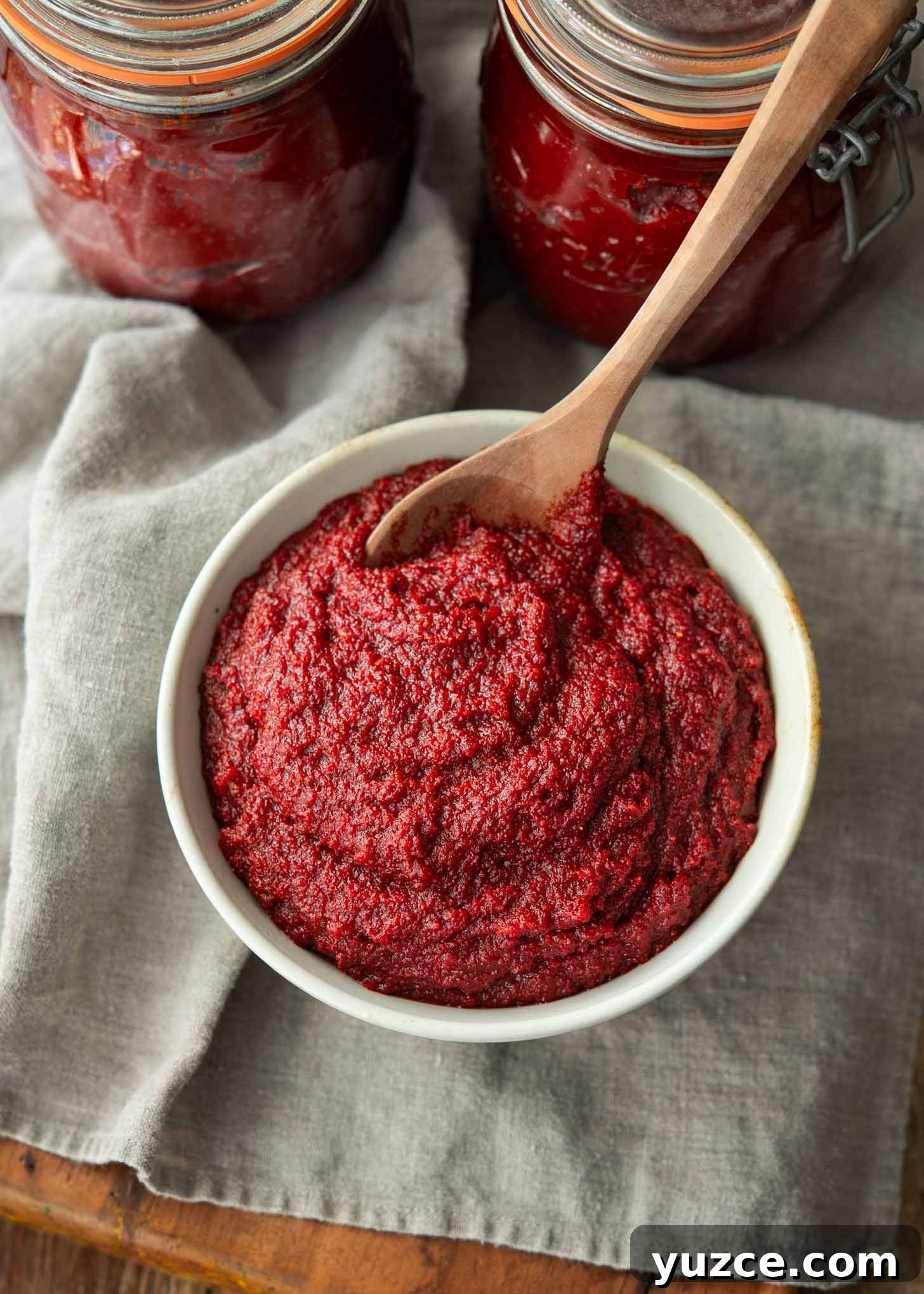 Quick 10-Minute Homemade Gochujang Recipe 3 Homemade Korean chili paste divided in a bowl and glass jars.