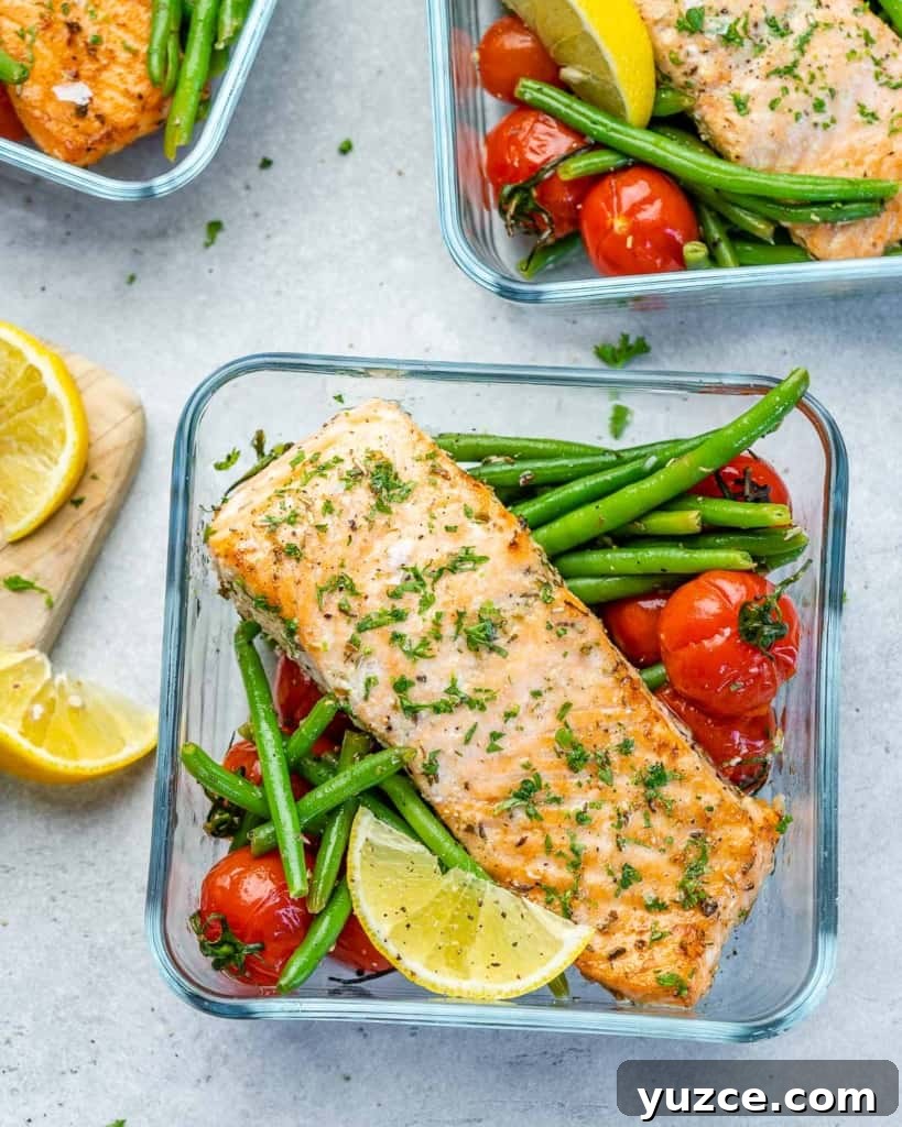 Oven-Baked Salmon Meal Prep Recipes for Weekly Dinners 2 Top view of three salmon meal prep bowls with green beans and tomatoes