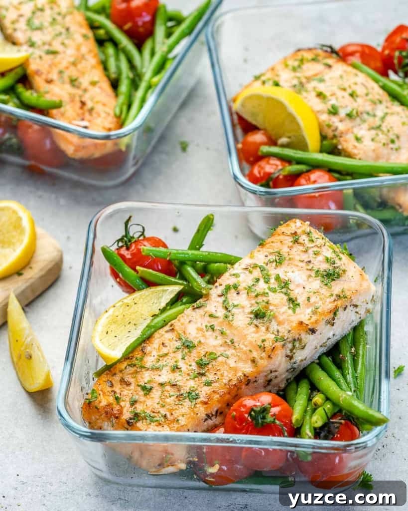 Oven-Baked Salmon Meal Prep Recipes for Weekly Dinners 3 Salmon meal prep bowls with green beans and tomatoes with lemon