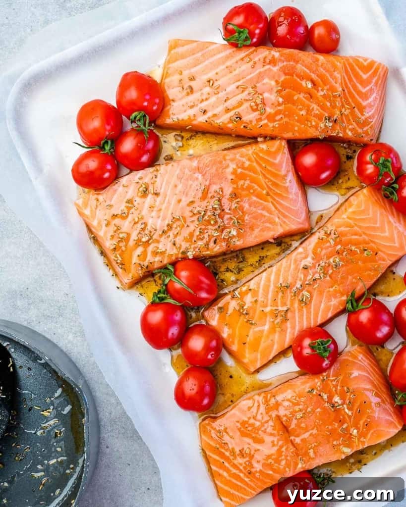 Oven-Baked Salmon Meal Prep Recipes for Weekly Dinners 6 Salmon fillets with tomatoes and seasoning