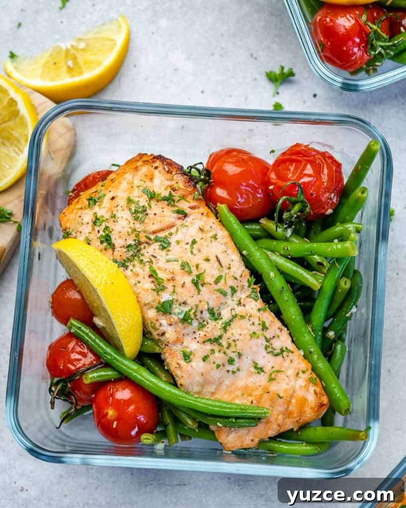 Oven-Baked Salmon Meal Prep Recipes for Weekly Dinners 7 Salmon sitting on top of tomatoes and green beans