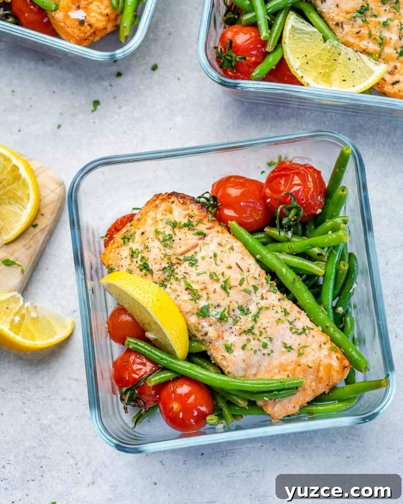 Oven-Baked Salmon Meal Prep Recipes for Weekly Dinners 8 One meal prep bowl filled with salmon, tomatoes, and green beans