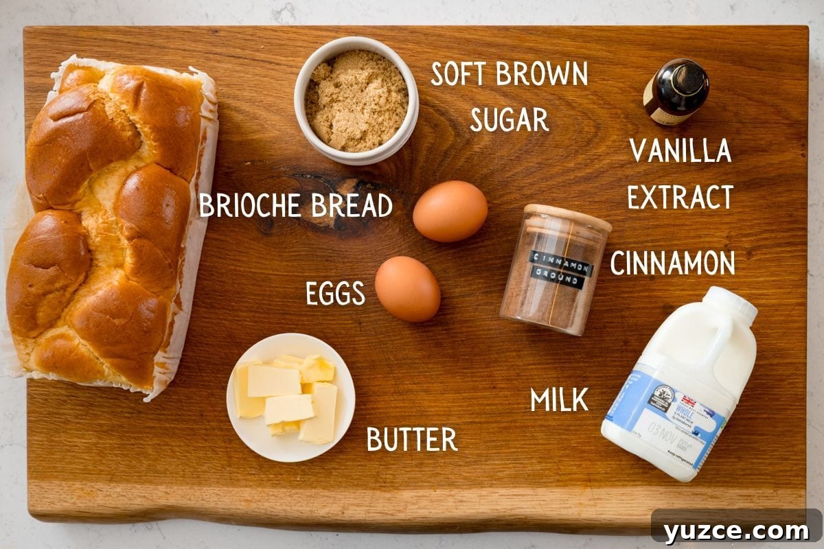 A wooden board displays ingredients for the best French toast recipe—brioche bread, eggs, soft brown sugar, vanilla essence, cinnamon, milk, and butter—each labelled with text.