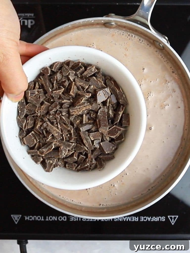 Decadent Homemade Hot Chocolate Recipe — Rich, Creamy & Velvety 12 chopped chocolate and a pot of milk