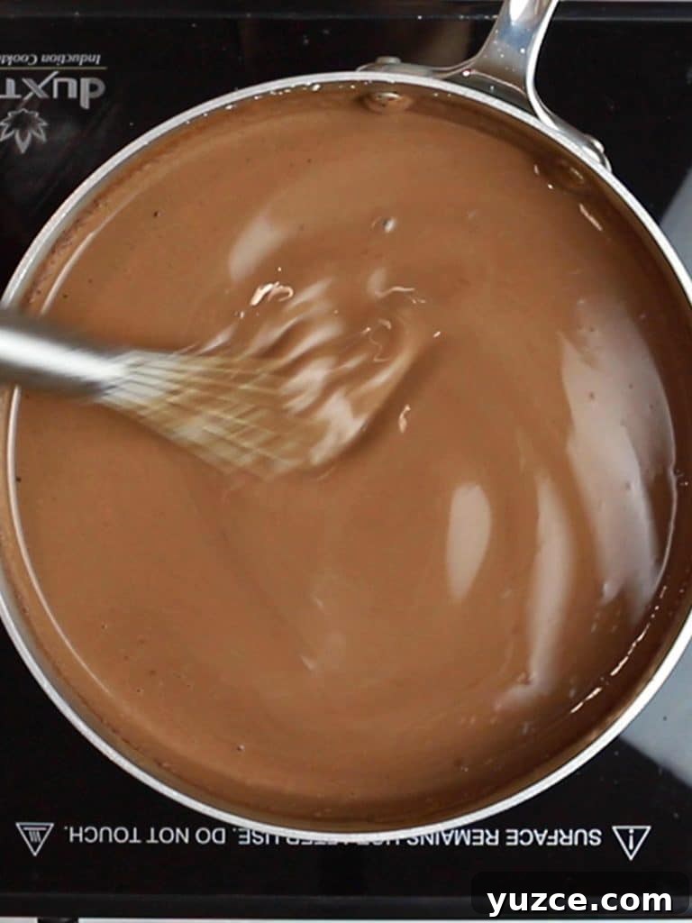 Decadent Homemade Hot Chocolate Recipe — Rich, Creamy & Velvety 15 homemade hot chocolate heating in a pot
