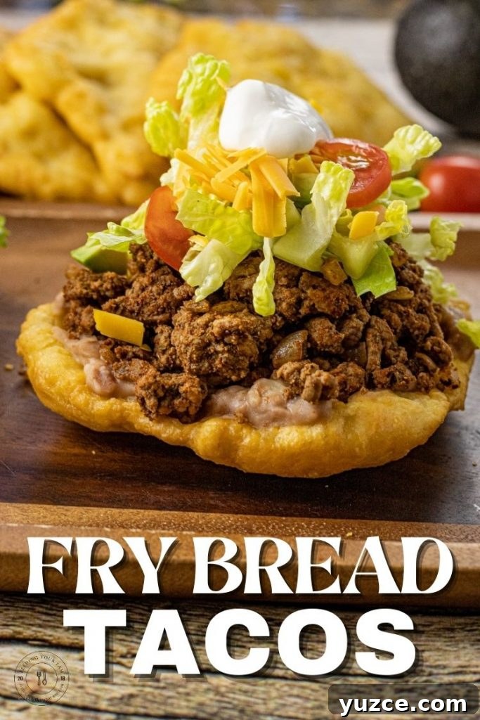 Fry Bread Tacos: Classic Family Dinner Recipe 5 scones topped with taco meat, lettuce, cheese, tomatoes and sour cream
