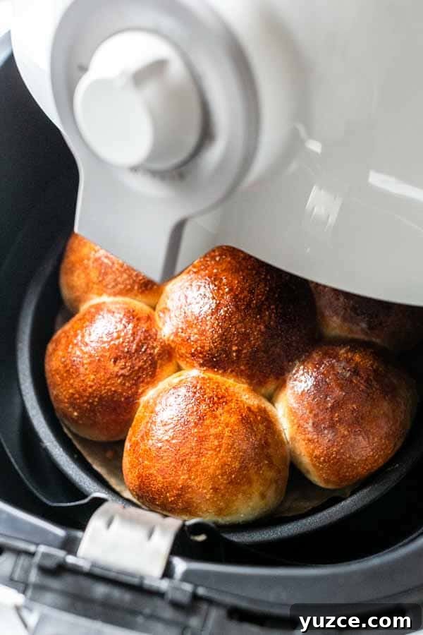 Crispy Air Fryer Dinner Rolls Recipe for Soft, Fluffy Buns 2 Soft and fluffy air fryer dinner rolls served with soup.