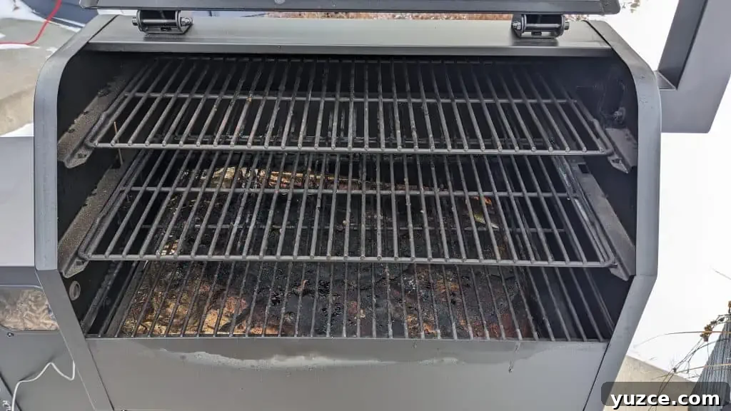 interior of grill showing grill grates, plus two additional shelves interior of grill showing grill grates, plus two additional shelves