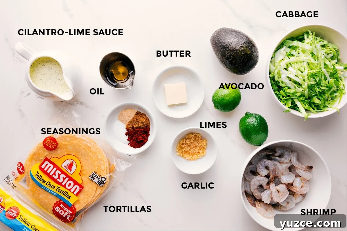 Ingredients In Shrimp Tacos All the ingredients in this recipe prepped out for easy assembly including the cilantro lime sauce, seasonings, tortillas, butter, garlic, limes, avocado, shrimp, and cabbage.