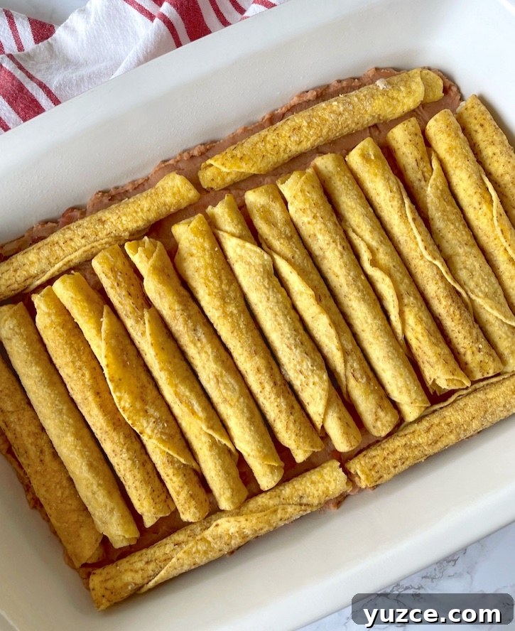 Quick Frozen Taquito Enchiladas: 30-Minute Weeknight Recipe 6 How to make frozen taquitos not suck! Smother them in enchilada sauce and cheese to make delicious enchiladas.