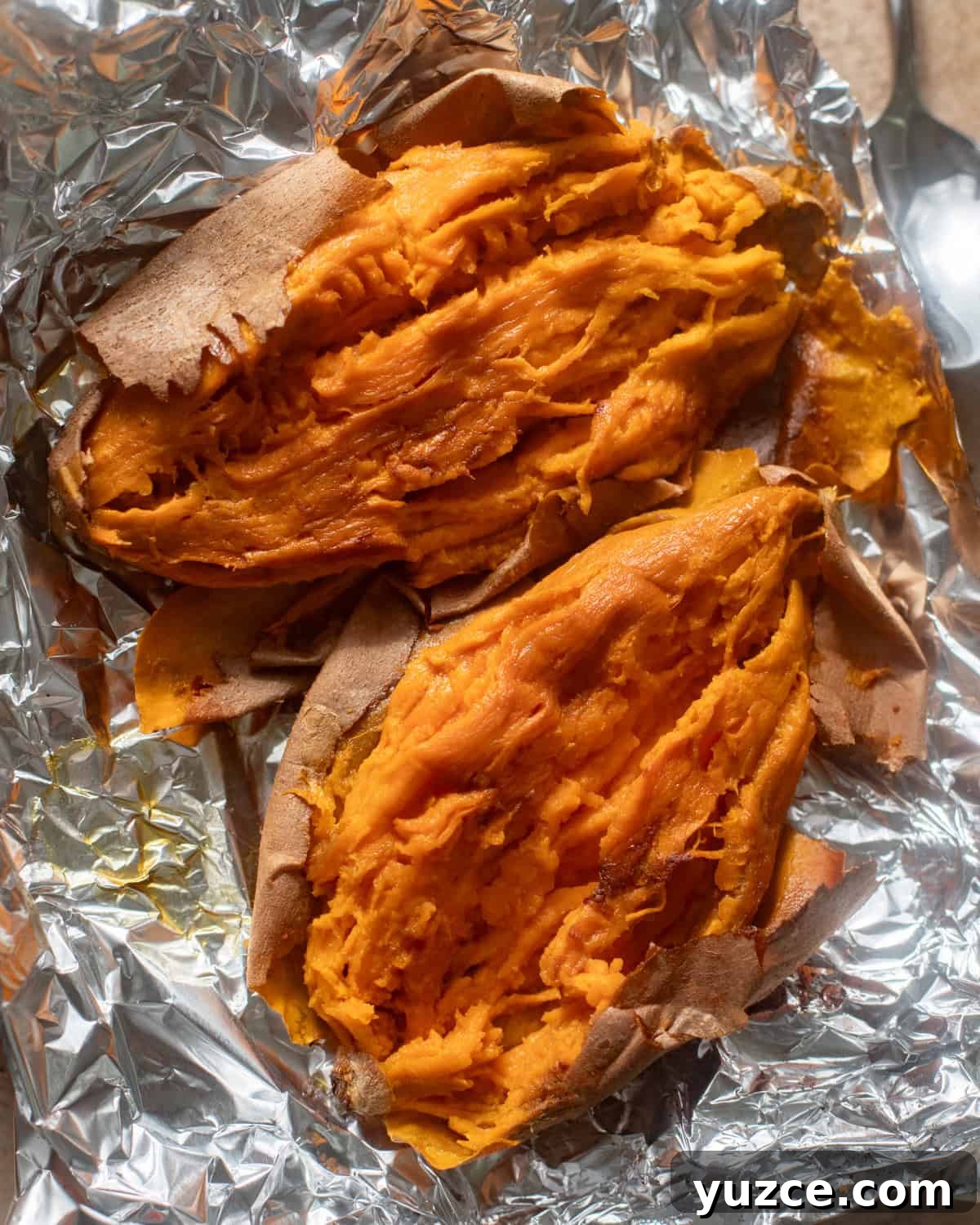 mashed sweet potatoes on a piece of aluminum foil.
