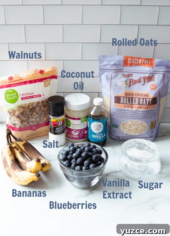 Ingredients on a marble countertop for making oatmeal muffins.