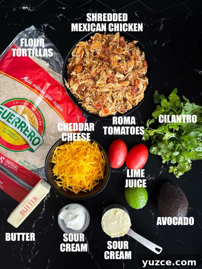Crispy Baked Chicken Chimichangas with Cheesy Filling 3 Baked chicken chimichanga recipe ingredients on a dark surface.