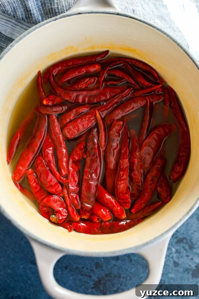 chiles de arbol in a saucepan cooked