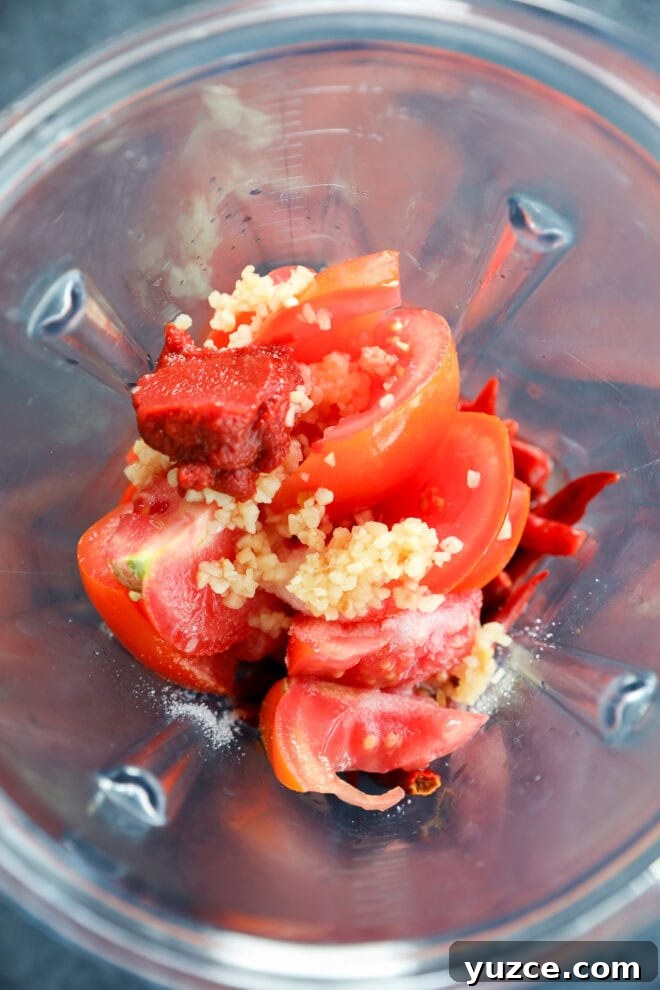 tomatoes, tomato paste, and garlic in a blender