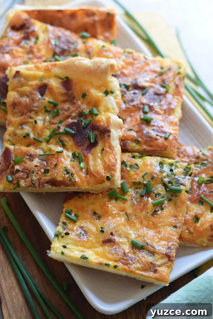 Flaky Puff Pastry Breakfast Quiche with Spinach and Cheese 3 Close up of puff pastry breakfast quiche.