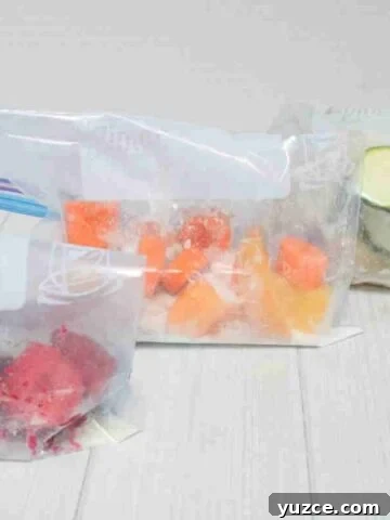 Three freezer smoothie packs lined up.