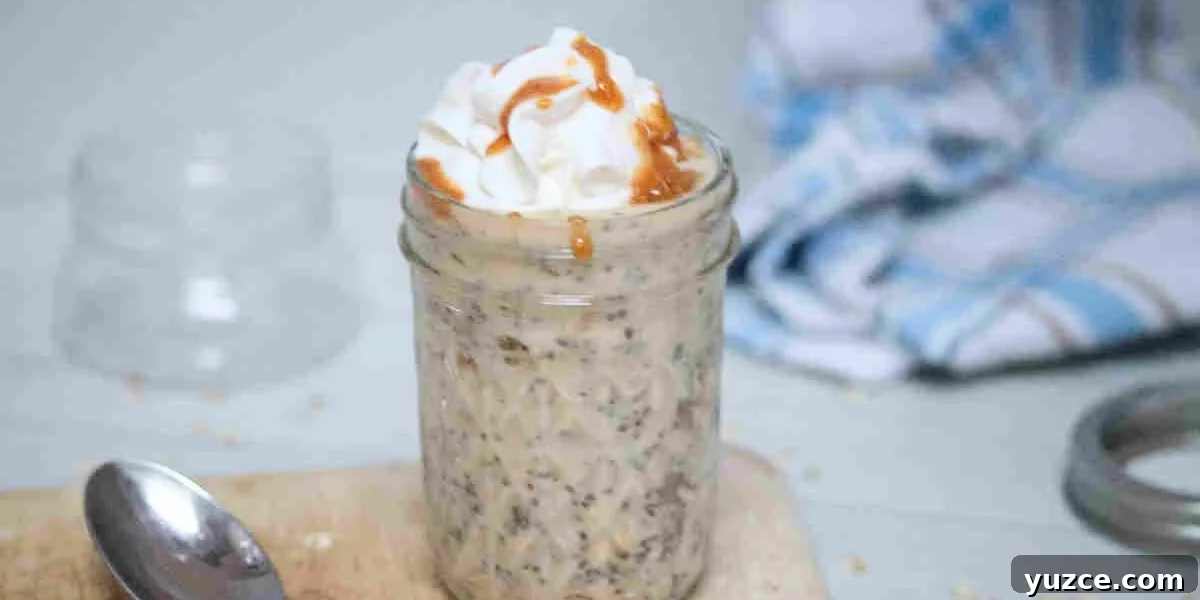 Protein-Packed Overnight Oats Recipe for Quick Breakfast 14 Mason jar with overnight protein powder oats topped with whipped cream and sauce.