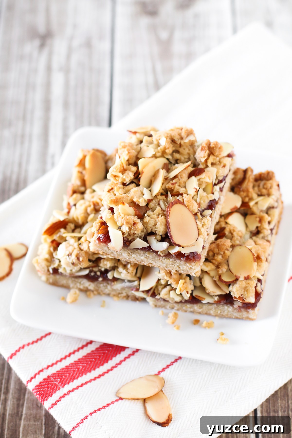 Gluten-Free Vegan Raspberry Almond Crumble Bars 3 Gluten Free Vegan Raspberry Almond Crumb Bars. Layers of crumb topping, sweet raspberry jam and toasted almonds. The perfect bite!