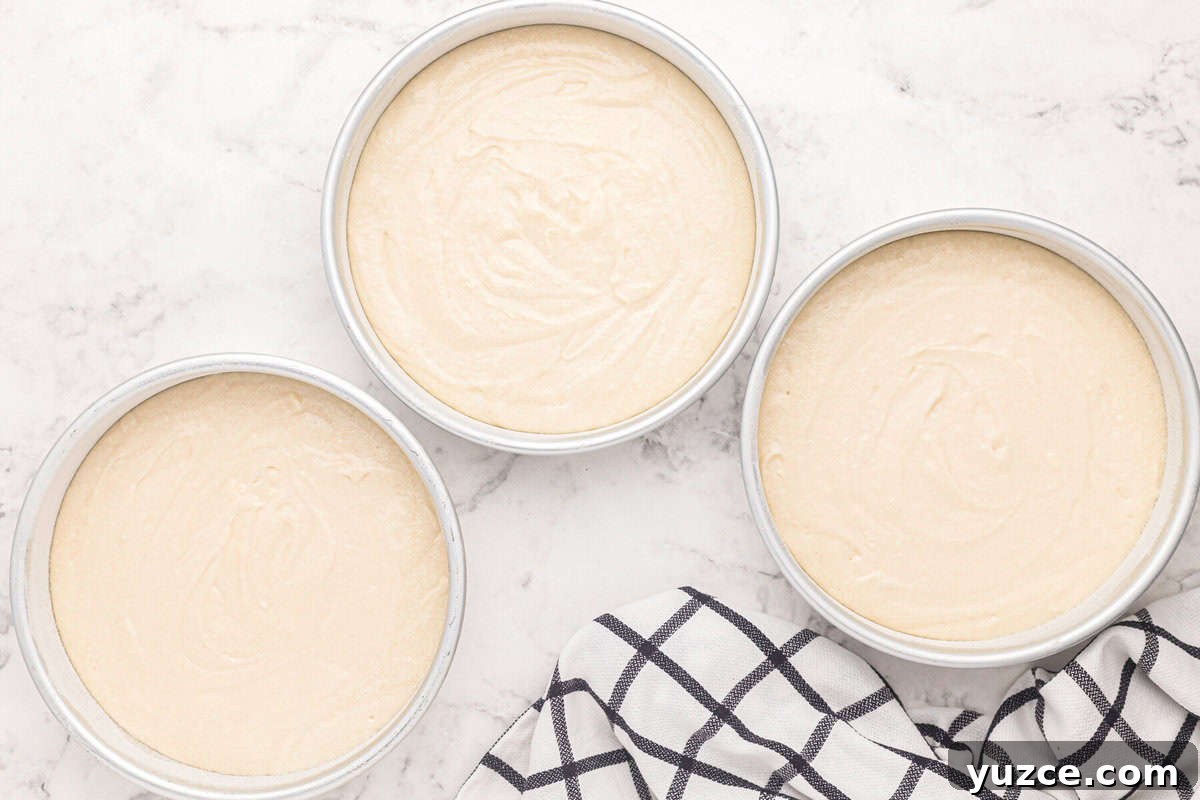 Elegant White Wedding Cake Ideas for Timeless Celebrations 10 white wedding cake batter divided between 3 round cake pans.