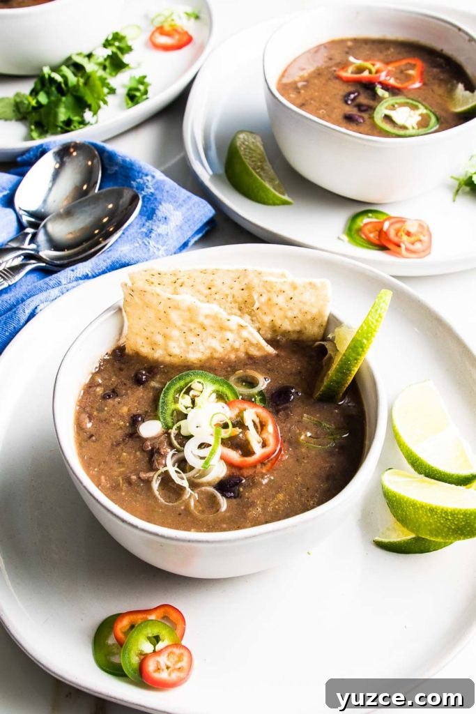 Bowls of soup with colorful toppings.