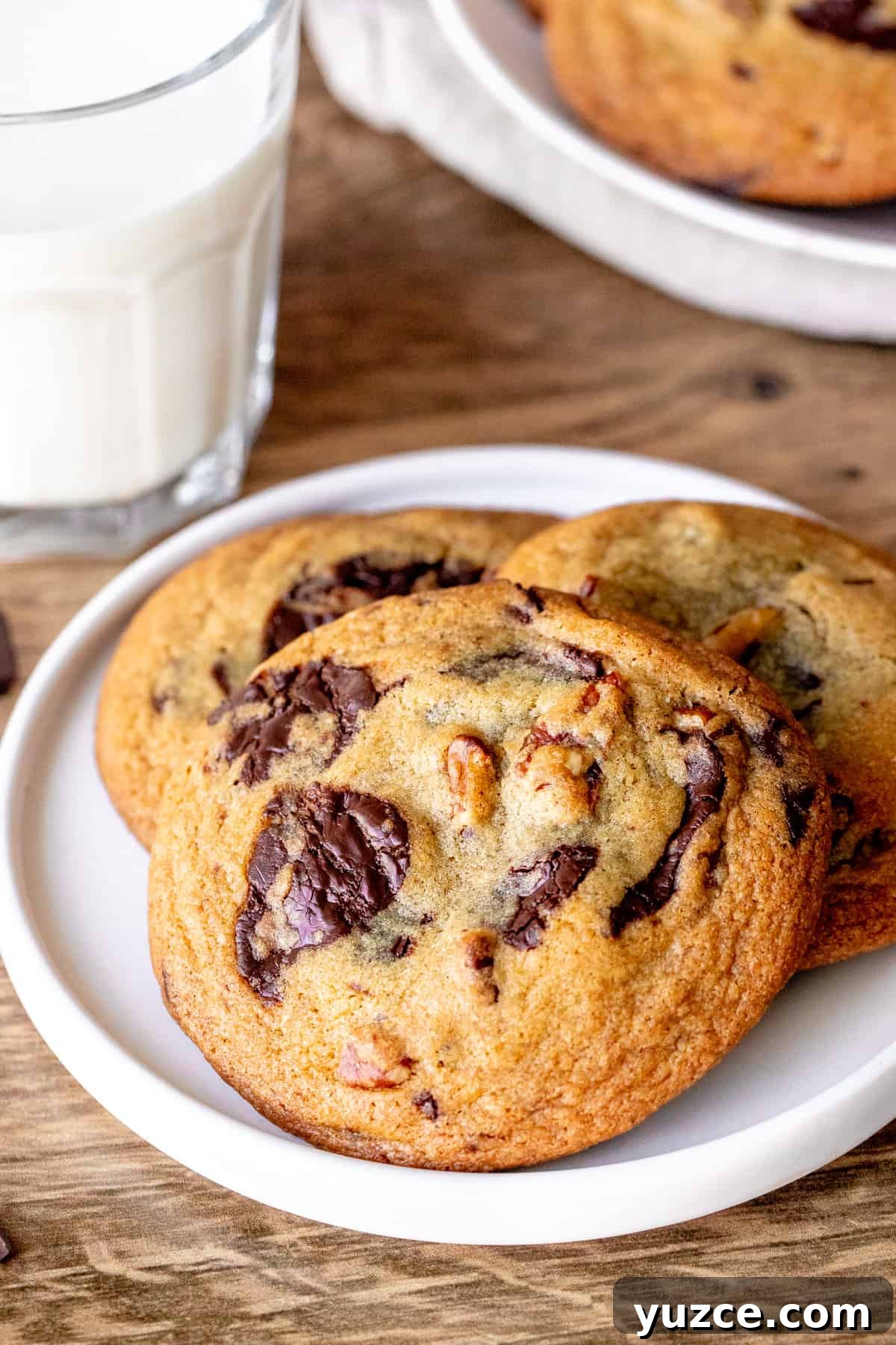 Brown Butter Pecan Chocolate Chip Cookies That Melt in Your Mouth 2 Plate of pecan chocolate chip cookies