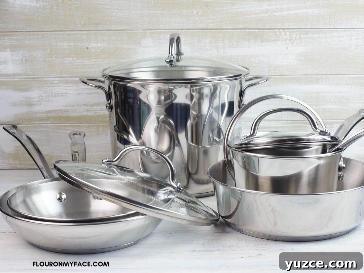 Win Farberware Cookware: Enter the Sweepstakes for Premium Pots & Pans 2 Photo of the Farberware 10 piece Millennium stainless steel cookware set on a table top.