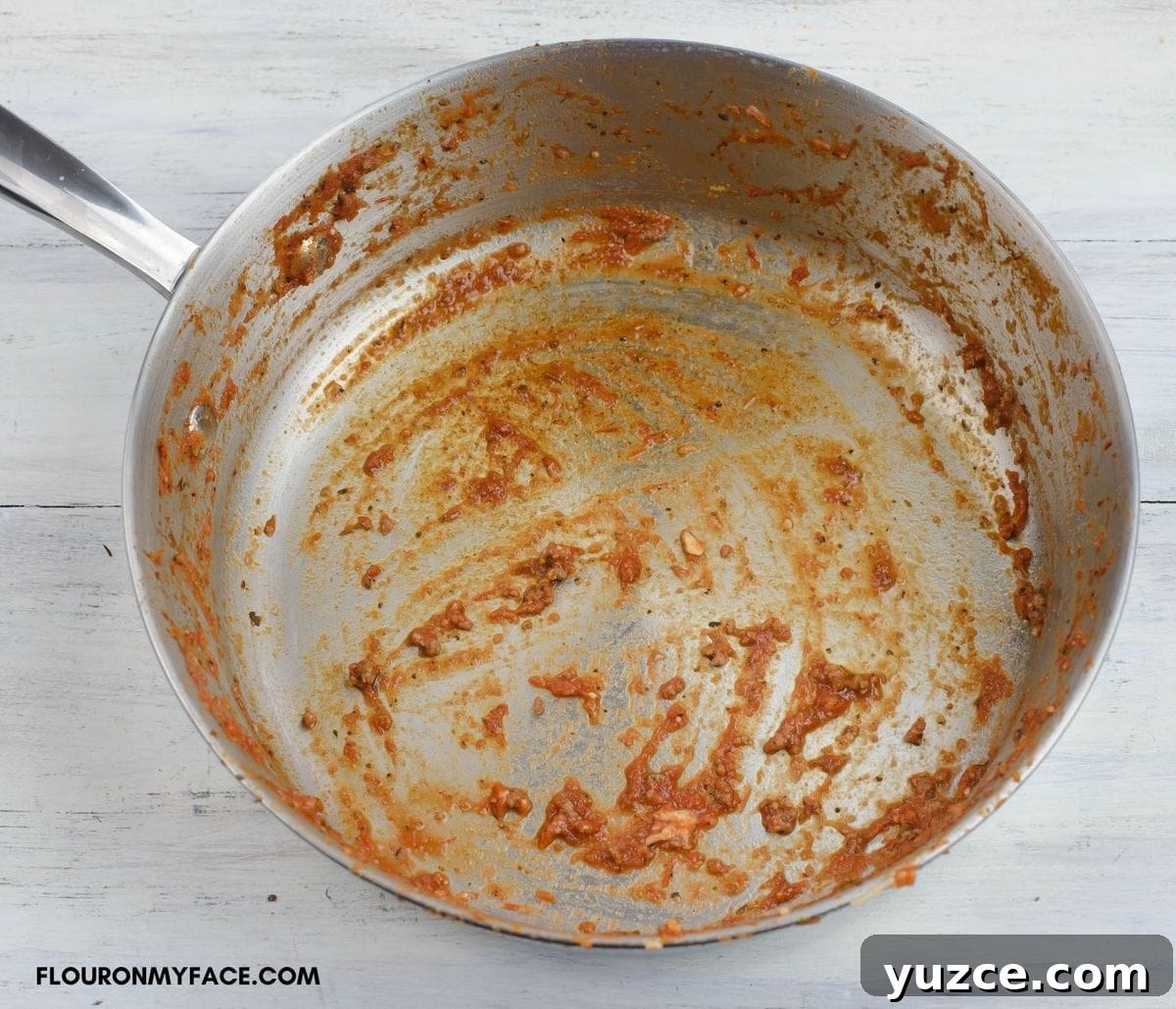 Win Farberware Cookware: Enter the Sweepstakes for Premium Pots & Pans 11 A large non stick skillet with pasta sauce coating the bottom and sides before washing.