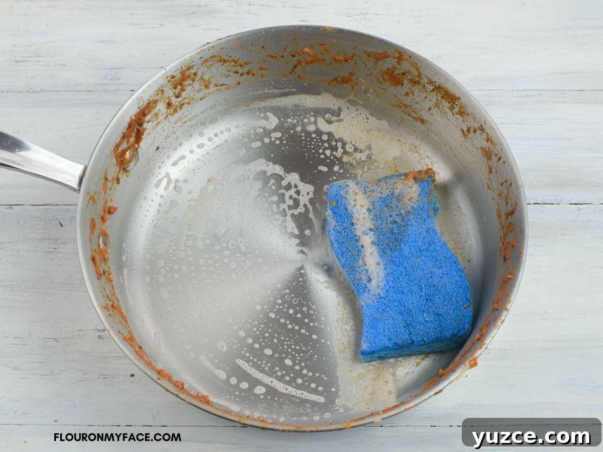 Win Farberware Cookware: Enter the Sweepstakes for Premium Pots & Pans 12 Cleaning a non stick skillet with sponge and soap.