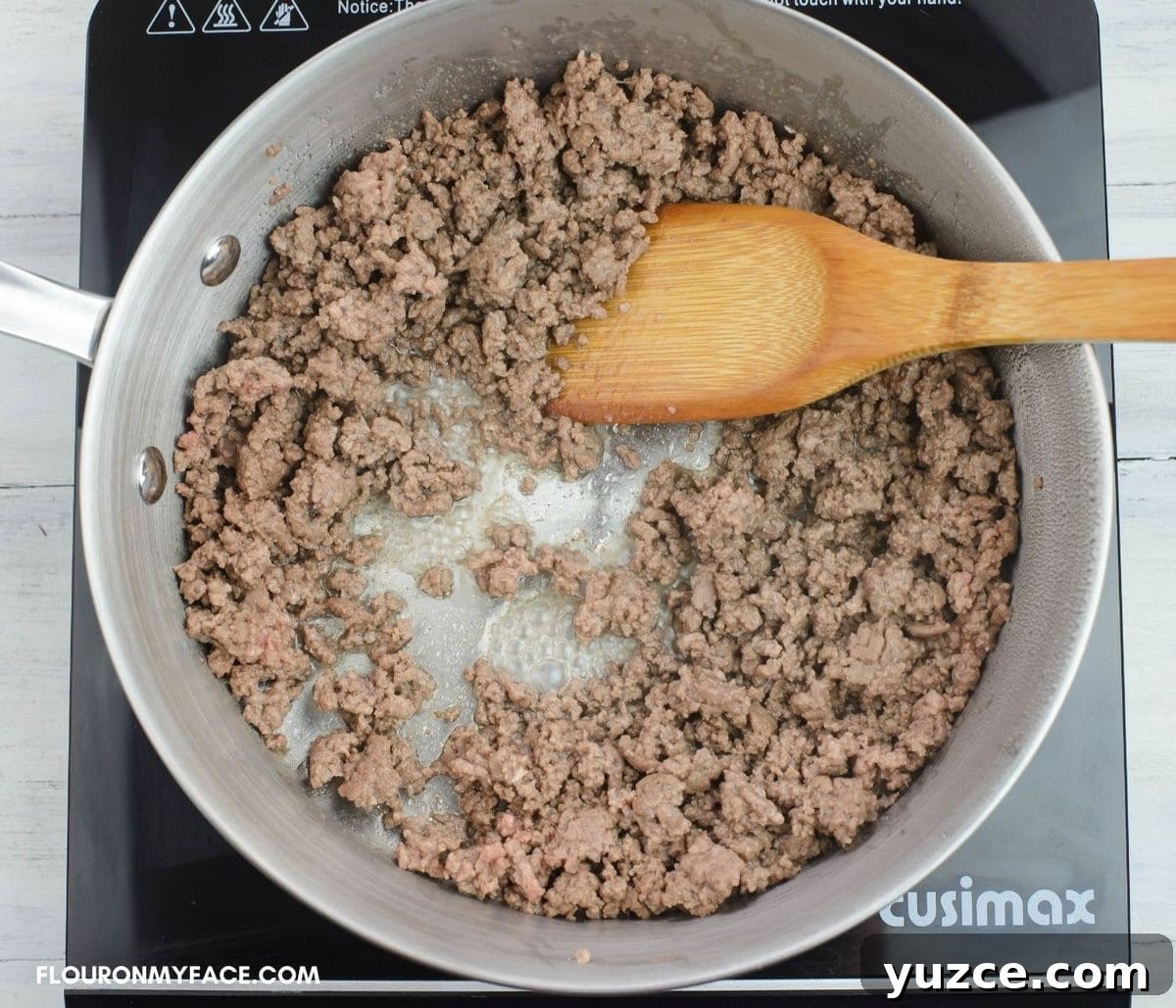 Win Farberware Cookware: Enter the Sweepstakes for Premium Pots & Pans 9 Browning ground beef for homemade pasta sauce in a skillet.
