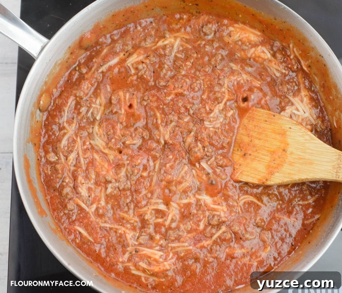 Win Farberware Cookware: Enter the Sweepstakes for Premium Pots & Pans 10 Simmering homemade pasta sauce in a large skillet.