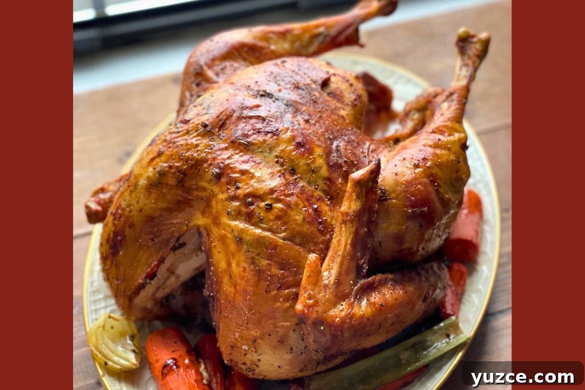 13 Crockpot Thanksgiving Recipes to Save Oven Space 15 A golden-brown roasted turkey served with vegetables on a plate.