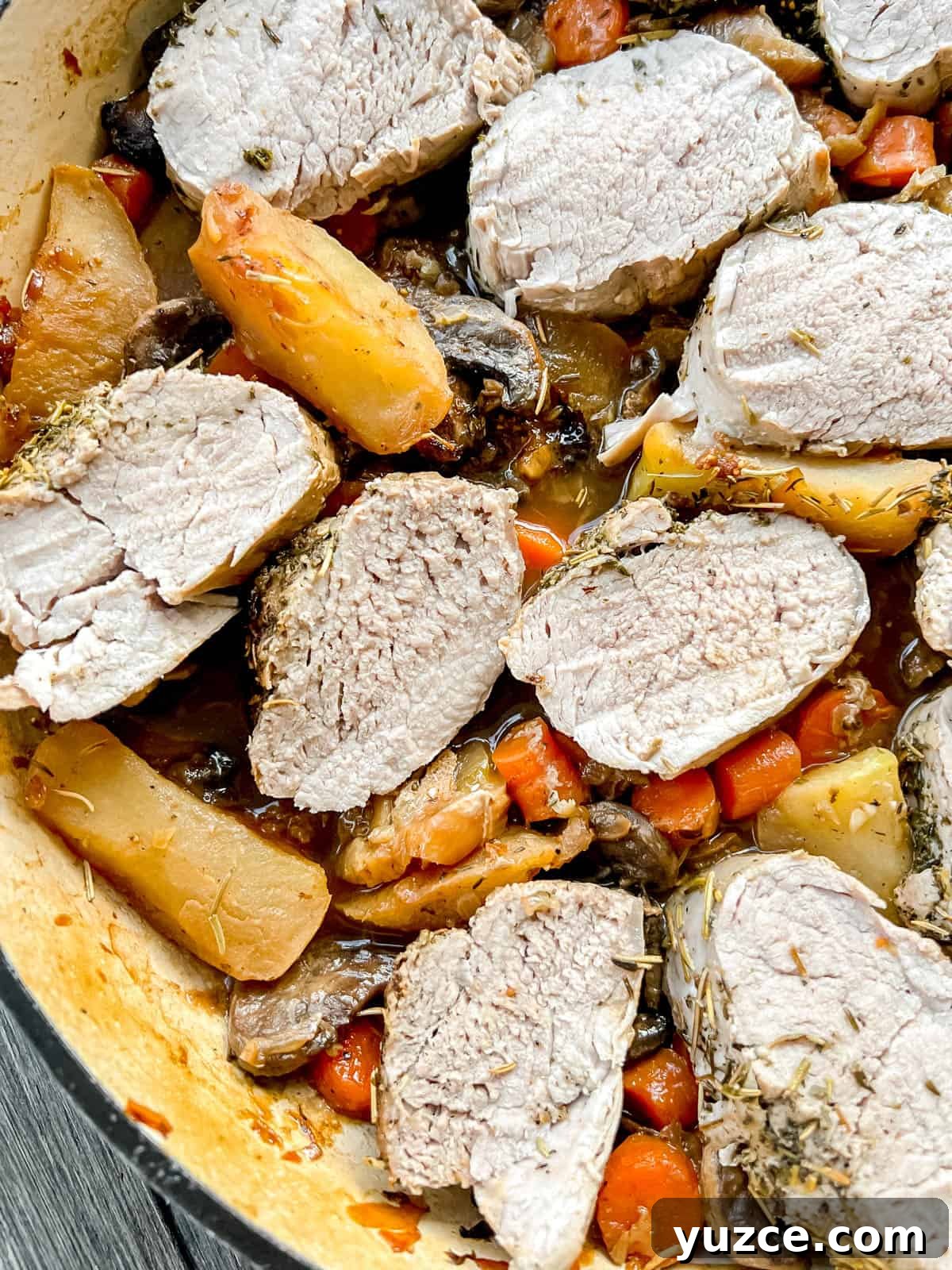 Dutch Oven Pork Tenderloin with Apples, Figs & Balsamic Glaze 9 Fig pork tenderloin in a dutch oven.