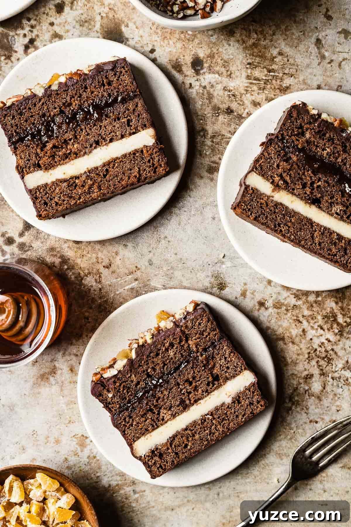 Traditional Polish Piernik Gingerbread Cake Recipe 7 Slices of Polish honey spice cake on tan plates and a brown background.