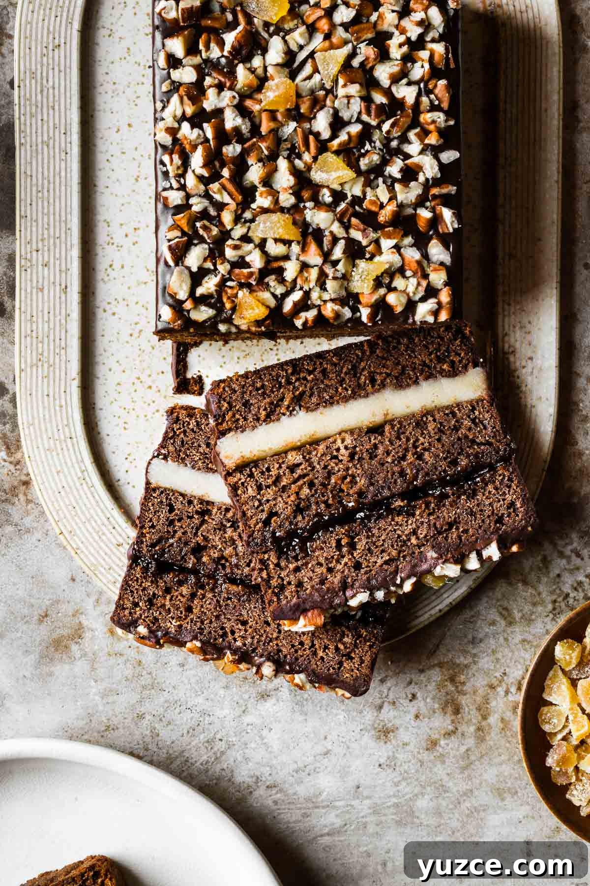 Traditional Polish Piernik Gingerbread Cake Recipe 9 A top view of a piernik cake with two slices resting on the platter.